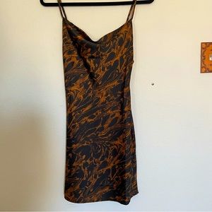 Cowl neck slip dress with slight curve on the hips